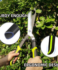 Heavy Duty Hedge Clippers With Sharp Wavy Blades For Easy Pruning shown cutting green shrub