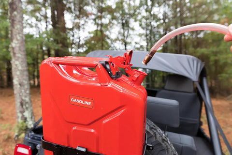 One Half Inch X Eight Foot Self Priming Jiggler Siphon Hose Transfers Gas Water Oil Fast Up To Four Gallons Per Minute No Sweat Quick Transfer Tube attached to red gasoline can.