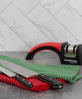 Pronto Hone 15 Degree Knife Sharpener Two Stage For Straight Edge And Serrated Knives on kitchen counter with knives and towels