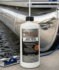 Bottle of Metal Polish With Long Lasting Sealant Cleaner Polisher Protectant All In One on dock beside metal boat