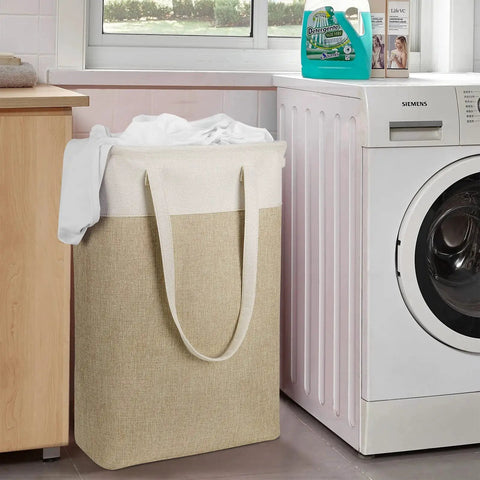 Two-Pack Slim Laundry Hampers Set In Beige And Khaki, Collapsible Linen-Like Fabric Baskets for Clothes, next to washing machine