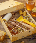 Beekeeping Tools Kit Pro Grade Two Piece Set with honey extractor, uncapping needle roller, and stainless steel unpapping fork.