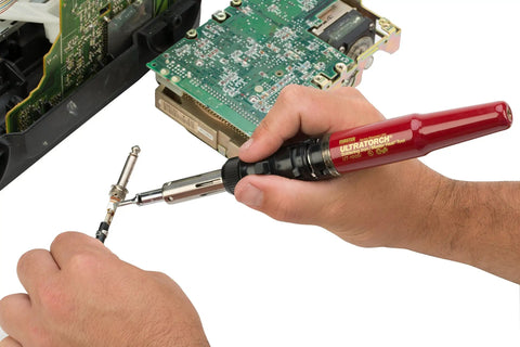 Person using Ultratorch UT-50 Pen Sized Butane Powered 3 In 1 Heat Tool Soldering Iron Flameless Heat Tool And Pinpoint Torch