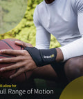 Man using adjustable wrist wrap for men and women, carpal tunnel relief, tendonitis support, one size neoprene wrist brace