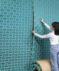 Top Shelf Self Adhesive Acoustic Foam Wall Panels For Home Recording Studios And Weight Training Spaces High Density Sound Deadening Tiles To Quiet The Space Peel And Stick Application For Easy DIY Installation, installation process, textured blue panels.