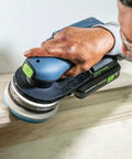 Person using a sander with Granat Profile Soft 5 Inch 125 mm Sanding Discs 10 Pack With Flexible Foam Backing on wooden contour
