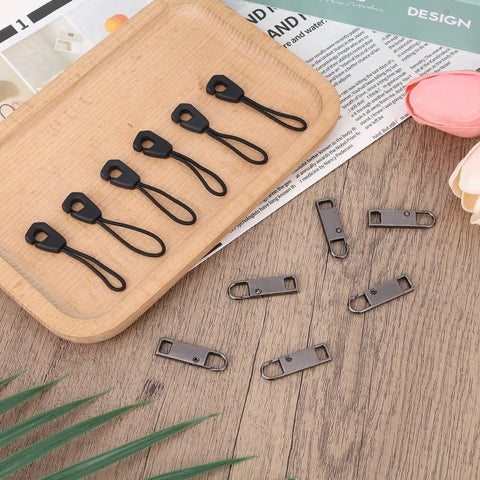 Detachable Metal Zipper Pull Replacement Kit With Six Heads And Six Extension Cords displayed on a wooden tray
