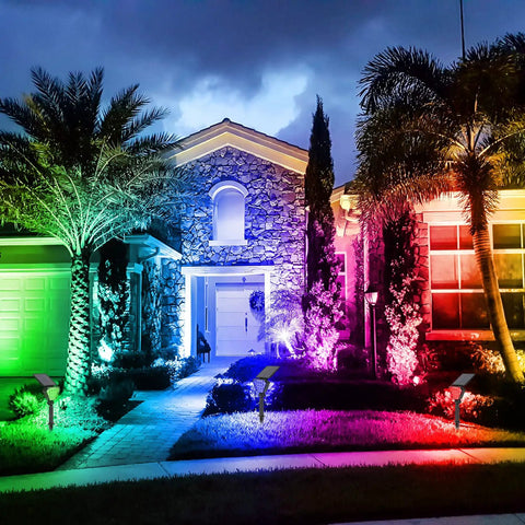 Super Bright Solar Spotlight With 36 LEDs, RGB Color Changing Outdoor Landscape Lights illuminating house at night, IP65 waterproof