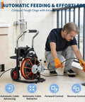 Man using Heavy Duty 100Ft Electric Drain Auger with Auto Feed 450W High Torque Motor to clear a drain.
