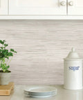 Cream Vinyl Grassweave Peel And Stick Wallpaper for easy DIY accent walls behind kitchen counter with plant and sugar jar