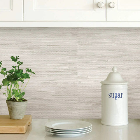 Cream Vinyl Grassweave Peel And Stick Wallpaper for easy DIY accent walls behind kitchen counter with plant and sugar jar