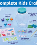 Totally Glowing Axolotl Aquarium Craft Kit For Kids Ages 6 And Up With Five Mini Axolotls, Glow In The Dark Decor, And STEM Fun, Hands On Arts And Science Gift For Girls And Boys clear kit layout with 5 axolotl figurines, plastic aquarium, stickers, and mix-ins