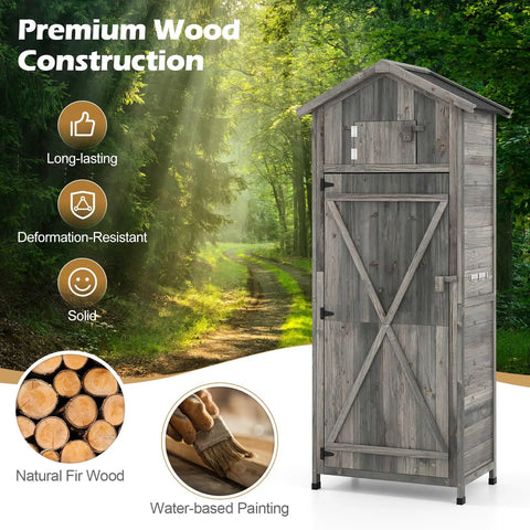 Outdoor Wooden Storage Shed With Tall Vertical Tool Cabinet Folding Table And Removable Shelves For Your Patio Deck Backyard And Lawn Grey Finish 30x20x70 Inches in forest setting