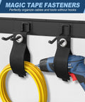 Heavy Duty Garage Wall Organizer System With Six Rails And Twelve Adjustable Hooks holding a drill and extension cord