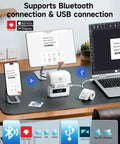 3 Inch Label Maker Portable Printer For Home Office, 2026 Upgrade With 2200mAh Battery on desk with phone and laptop