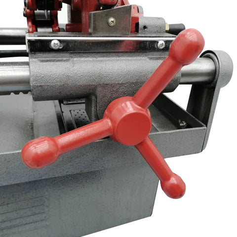 Close-up of the red handle on the Built Tough Electric Pipe Threader Machine For 1/2 To 3 Inch Steel Tubing Auto Die Head.