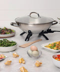Electric Wok With 1500 Watt Heating Stainless Steel Body Aluminum Clad Base For Fast Even Heating placed on kitchen counter