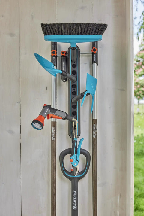 Ditch The Mess With This Slick Wall Rack Built For Garden Tools And Hand Pruners Zero Drama Garage Organization Kit holding shovels and pruners.