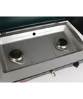 Top view of a two-burner propane camping stove with 20,000 BTU output, wind block panels, and pressure regulator, fits 10 and 12 inch pans.