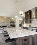 Integrated LED Pendant Light In Antique Brass With White Glass Shade hanging in modern kitchen over island.
