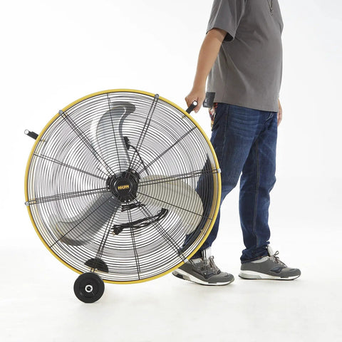 Person moving Heavy Duty High Velocity Barrel Floor Drum Fan With One Third HP Motor 13000 CFM 9 Foot Cord Five Inch Solid Wheels UL listed
