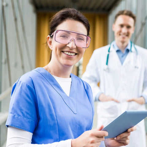 Healthcare professional wearing Anti Fog Safety Goggles For Men And Women With Blue Light Blocking UV Protection Dust Resistant Coating Scratch Resistant Lenses Pink Frame Unisex Eyewear For Work Home Or Travel Clear Vision And All Day Comfort