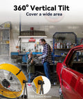 Garage workshop featuring 24 Inch Industrial Drum Fan With 8800 CFM High Velocity Air, heavy-duty metal, 360 degree tilt, wheels, yellow color