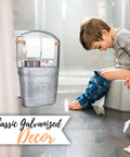 Farmhouse Freestanding Toilet Paper Holder With Reserve Storage For Mega Rolls And Magazines next to child on toilet