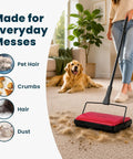 No Sweat Push Powered Carpet Sweeper With Triple Brush Heads For Big Time Dust Pickup On Area Rugs And Vinyl Floors in use collecting pet hair.