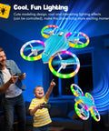 Light Blue Kids Drone With 3D Flip And Cool Light soaring indoors, controlled by smiling adults and kids.