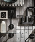 Gibson Two Handle Centerset High Arc Modern Bathroom Faucet With Drain Assembly Matte Black Finish against a tiled backdrop