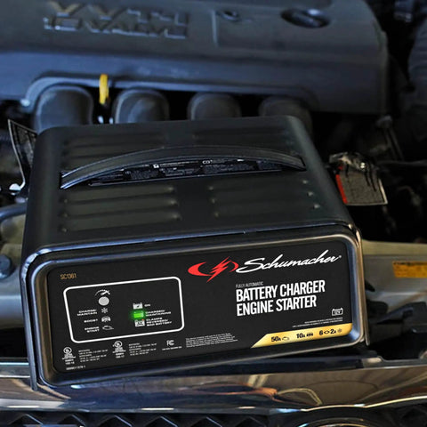 Beast 4 In 1 Car Battery Charger And 50 Amp Engine Starter with 10 Amp Boost placed on a car engine