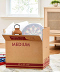 Sturdy 22x13x15 Shipping Boxes For Moving, Packing, Storage And Mail, Brown Kraft Cardboard Boxes filled with items, easy to assemble.