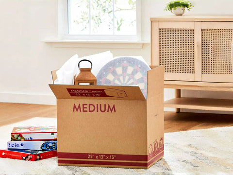 Sturdy 22x13x15 Shipping Boxes For Moving, Packing, Storage And Mail, Brown Kraft Cardboard Boxes filled with items, easy to assemble.