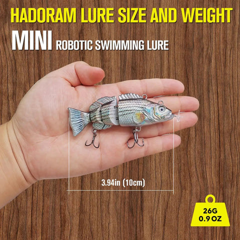 Hand holding Go To Auto Swimming Lure 3.9 Inch USB Rechargeable LED Swimbait With Four Jointed Segments Realistic Shad Pattern
