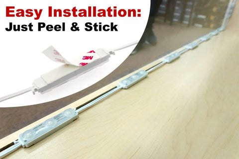12.5ft LED Kit With Dimmer For Showcases Display Cabinets Under Cabinet Lighting And Dressing Room Mirrors Easy Peel And Stick Ultra Bright White LEDs Korean Made DC 12V 2A Power Adapter Included showing easy installation with 3M tape on a wooden surface