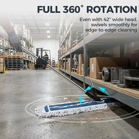 42 Inch Commercial Dust Mop With Extra Wide Flat Head Heavy Duty Swivel Design And Quick Release Handle That Picks Up Dust Without A Sweat For Warehouses And Commercial Spaces in a warehouse, showing swivel action.