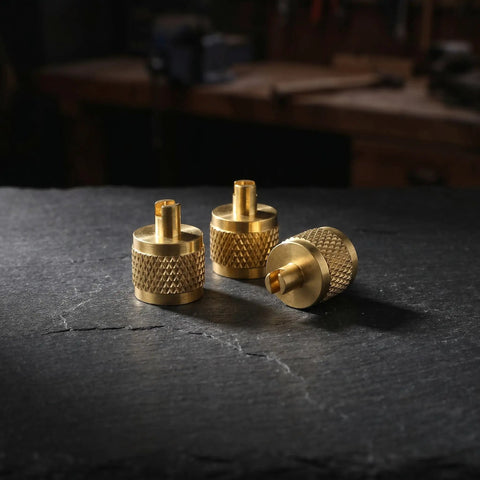 Professional Grade Beefy Brass Refrigeration Valve Caps With Slick Knurled Nozzles For Ac Systems And Coolant Lines Leak Proof Field Service Covers No Sweat Maintenance 30 Pack, three brass caps on slate surface.