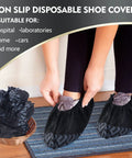 Person wearing 300 Pack Disposable Shoe Covers Non Slip Heavy Duty Black Booties For Indoors And Contractors, showing a basket of covers nearby