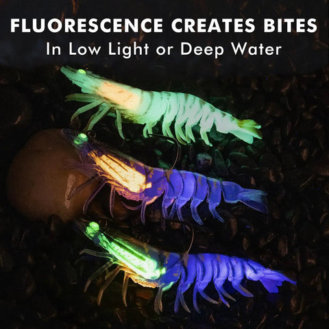 Fluorescent Duramax Pre Rigged Soft Fishing Lures With BKK Hooks glowing in the dark to attract fish in deep water.