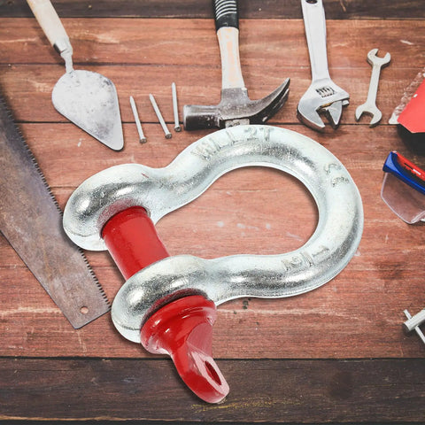 One Half Inch Galvanized Screw Pin Anchor Shackle Two Ton Kickass Lifting Rig For Trucks Built Strong With Zero Drama Off Road Tow Hook Mount Industrial Hardware Kit on wooden table with tools.