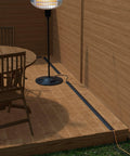30Ft Floor Cord Cover And Cable Protector for Home Office on wood deck, demonstrating flexible PVC cable management, black color.