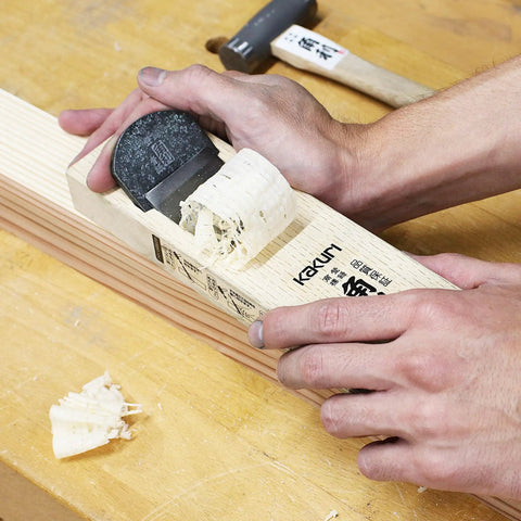 Pro Grade Japanese Kanna Pull Plane Hitachi Aogami Blue Steel Number Two Blade Solid Oak Body 58mm Wide in use on wood.