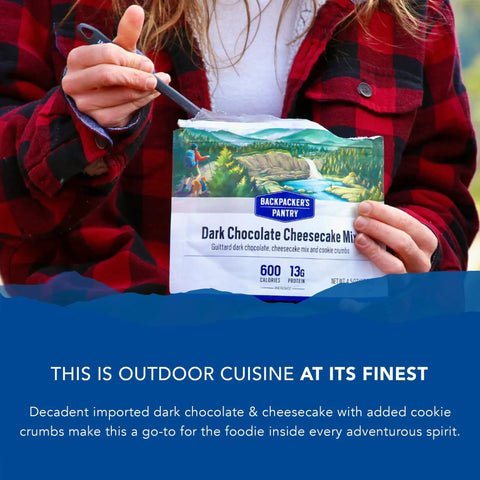 Person holding Dark Chocolate Cheesecake Mix For Backpacking And Camping Freeze Dried Dessert That Feels Like Home Easy Emergency Food Snack With 13 Grams Protein Vegetarian Packable Treat For Hiking And Outdoors