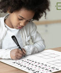 Child writing on 11 By 14 Dry Erase Multiplication Chart Whiteboard, Double Sided Multiplication Table For Homeschool
