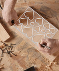 Heavy Duty Acrylic Heart Router Template For Practical Woodworking And Charcuterie Boards Features Twelve Cut Sizes with detailed heart patterns.