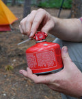 Fuel Transfer Kit For Backpacking And Camping With Flow Control Valve And Integrated Pressure Vent in hand outdoors