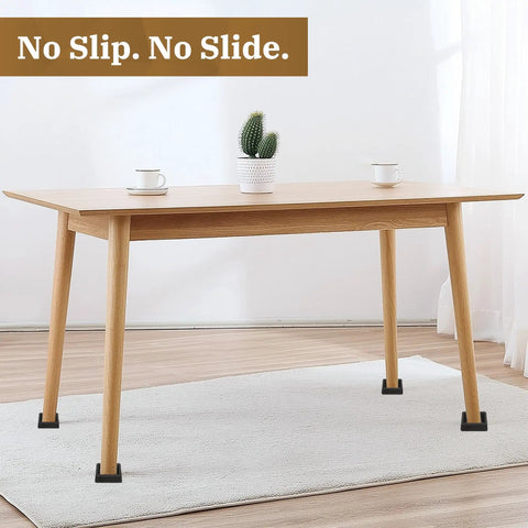 Non Slip Rubber Furniture Caster Cups Three Inch By Three Inch Square Black Floor Protectors under a wooden table on a carpet