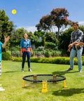 Family playing with Easy Setup Roundnet Game Set With Patented Net Includes Two Balls For Beach, Lawn, Or Backyard Fun Durable Elastic Net