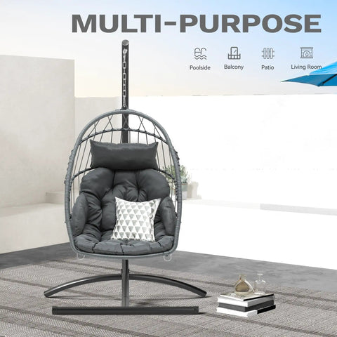 Egg Chair With Stand For Indoor And Outdoor Use, gray hanging rattan wicker swing chair with cushion, shown on patio.